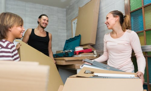 Professional commercial movers preparing office equipment for relocation in Wales.