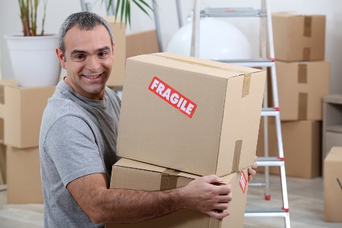 Professional movers handling furniture pickup in Wales