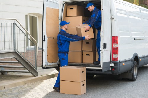 Team packing office supplies using high-quality materials during a commercial move.