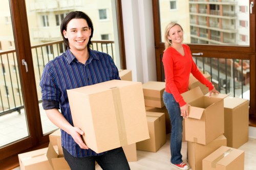 Movers assembling furniture at a new home
